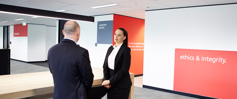 Ricoh employees standing around table
